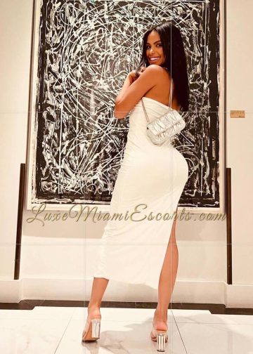Amateur photo of Miranda, posing in sexy white dress