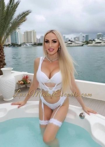 Ruslana posing in hot tub, wearing beautiful white lingerie and stalkings