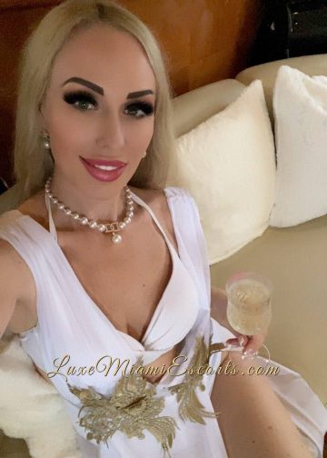 Selfie of beautiful Miami escort Ruslana, wearing sexy white dress
