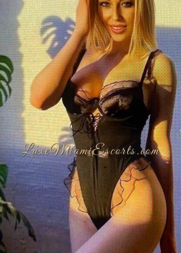 Professional photo of Ruslana, posing in sexy black nightwear