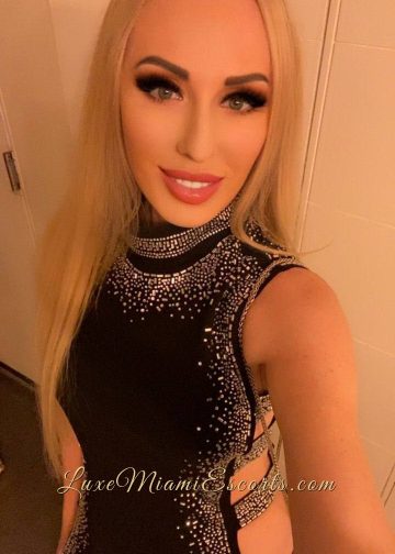 Selfie of Miami escort Ruslana, wearing sexy dark grey dress