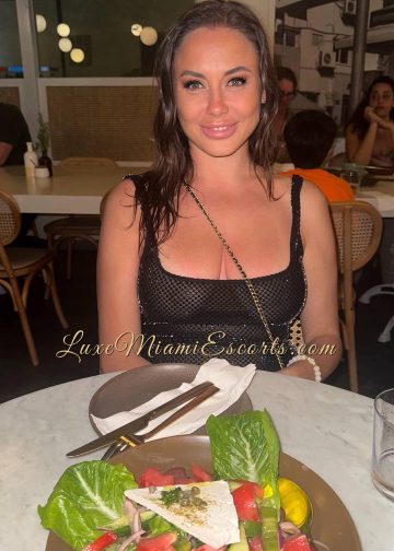 Amateur photo of Masha, sitting at the restaurant table