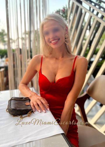 Glamorous model Melissa posing at the restaurant in sexy red dress