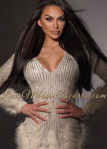 Hot Miami Latina escort Lucia wearing elegant beige dress