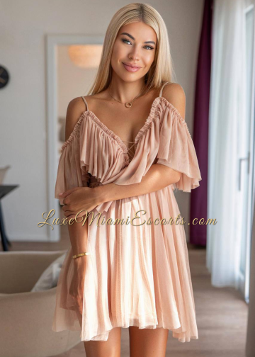 Blonde Miami escort Olga in sexy pink dress