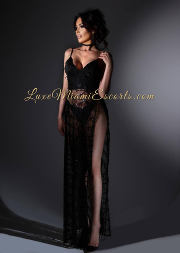 Brunette Miami escorts girl Amelia posing in sexy black dress